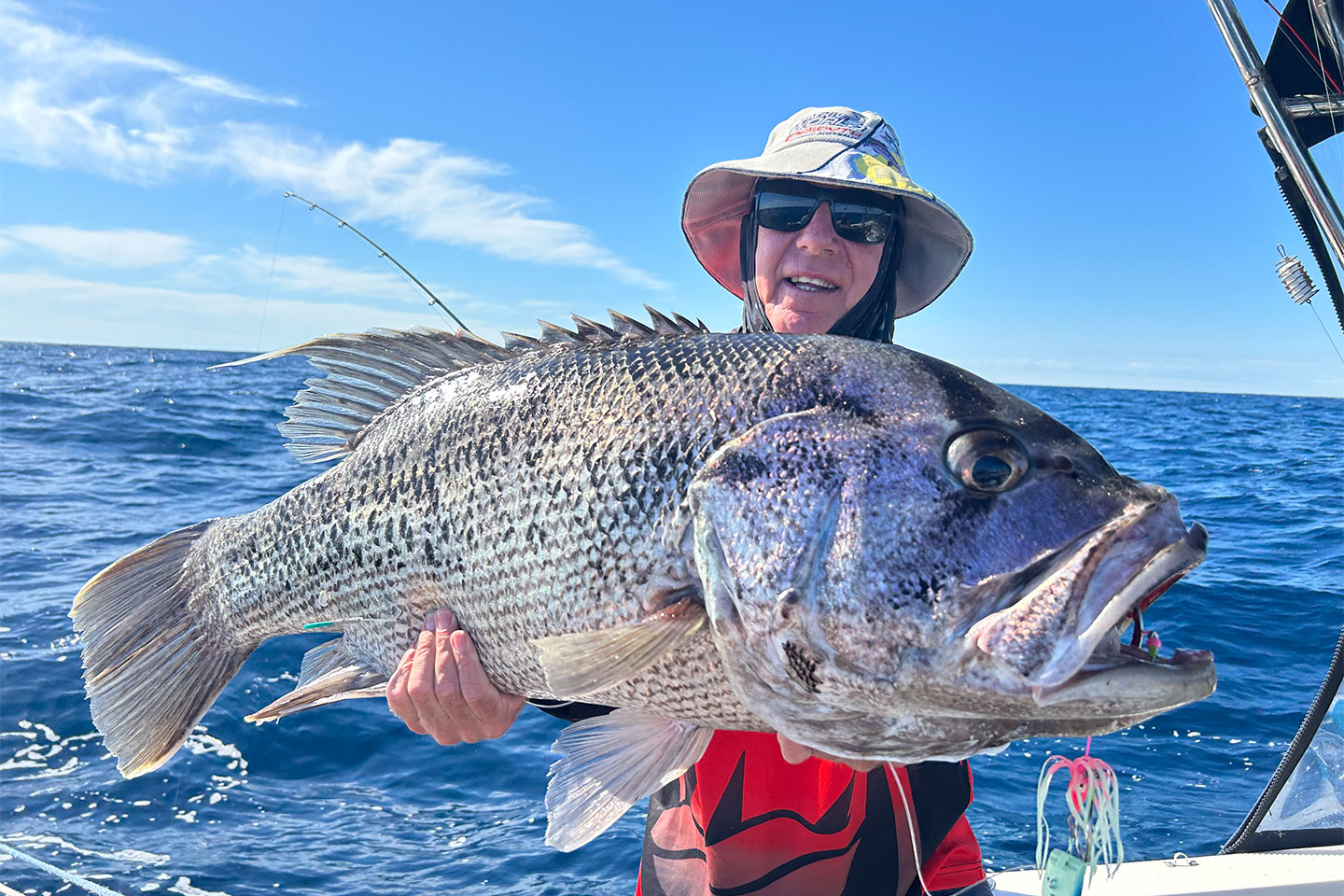 Fisherman holding huge Dhu Fish caught off the coast of Western Australia